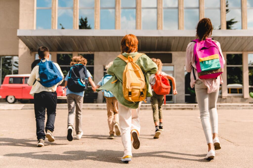 Picture of a group of students arriving to school together excited and energized for the day